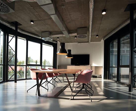 a conference room with floor-to-ceiling windows