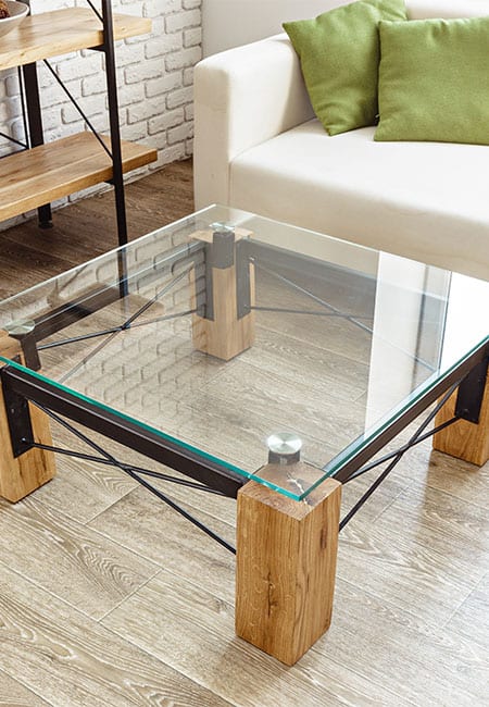 glass table with wood and metal legs
