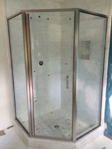 a custom glass shower wall and door